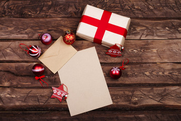 Envelope on wooden background with Christmas decorations