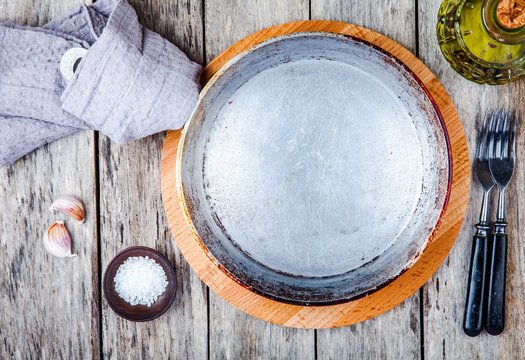 empty cast-iron pan on a wooden background