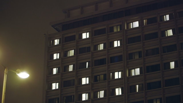 Hospital building exterior night windows.