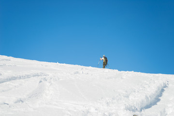 Naklejka na ściany i meble Alpine ski touring towards the summit