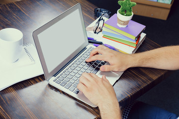 Man working woth laptop in library