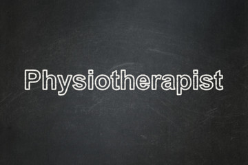 Obraz premium Healthcare concept: Physiotherapist on chalkboard background