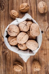 Walnuts on a wooden background