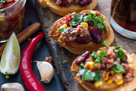 Chili con carne served on toast