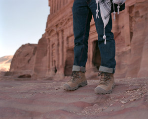 Hiker's legs at the Royal Tombs in Petra