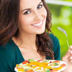  happy smiling woman with salad, outdoor