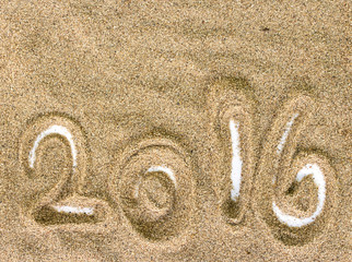 Beach Sand Texture and Background with 2016 on white
