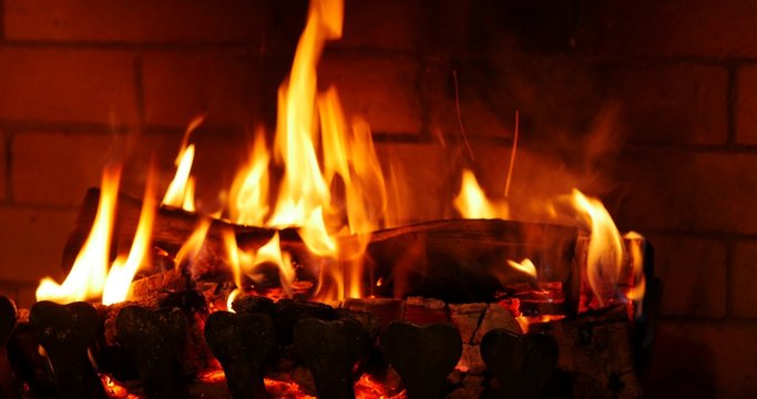 the dying embers in the fireplace