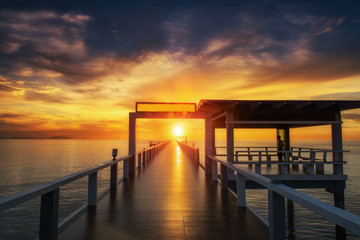Fototapeta na wymiar Summer, Travel, Vacation and Holiday concept - Wooden pier between sunset in Phuket, Thailand