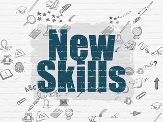 Learning concept: New Skills on wall background
