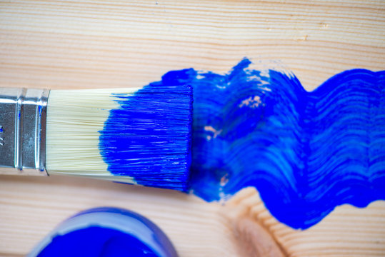 Painting of Wooden Planks with Brush and Blue Color Paint
