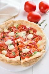 Tomatoes pie with cheese and dill