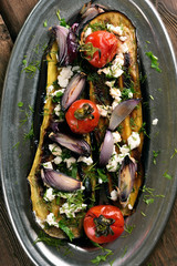 Roasted eggplant with tomatoes, onion and cheese