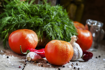 Preparing for canning tomatoes: dill, garlic, pepper and spices