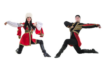 young couple wearing a folk costume dancing against isolated white with copyspace