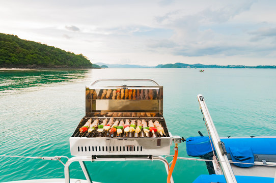 Fototapeta Barbecue grill on the boat. Luxury boat party in Phuket, Thaialn
