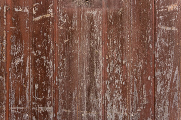 Vintage texture of wooden red paint to crack. Close-up.