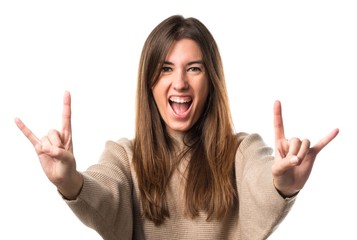 Girl making horn gesture