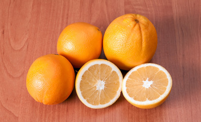 Close up of fresh oranges on wooden board