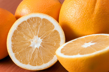 Close up of fresh oranges on wooden board