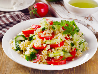 Tabbouleh salad with bulgur, parsley and vegetables