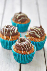 five cupcakes in blue glands
