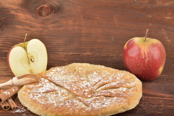 Sweet homemade apple pie with cinnamon and sugar