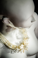 necklace on a mannequin
