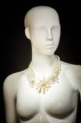 necklace on a mannequin
