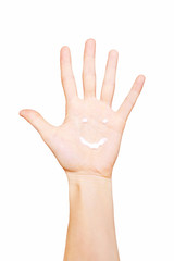 Smile painted hand cream on palm
