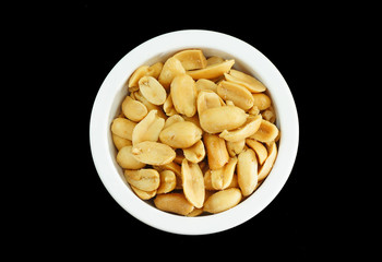 Salted peanuts, isolated on black background