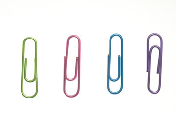 colored paperclips isolated on white.