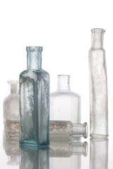 Antique bottles on white table