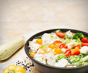Colorful fresh stewed vegetables on pan