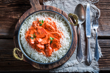 Delicious tikka masala with rice and chicken in tomato sauce