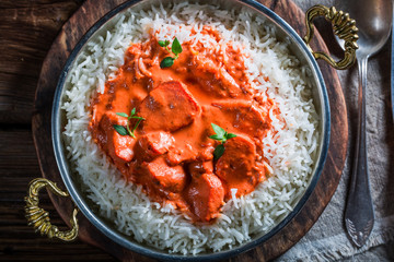 Delicious tikka masala with rice and sauce
