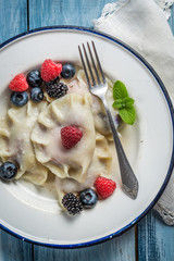 Sweet dumplings with blueberry, blackberry and raspberry