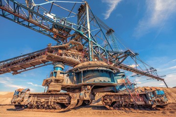 Large excavator machine in the mine