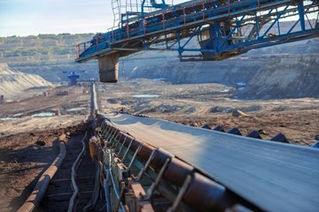 Long conveyor belt transporting ore