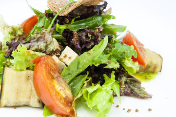 salad vegetables and goat cheese on a white background