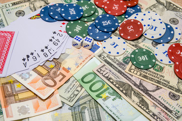 Euro and dollar with playing cards and poker chips