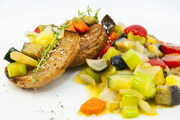 steamed vegetables, tomatoes celery eggplant with rye rolls