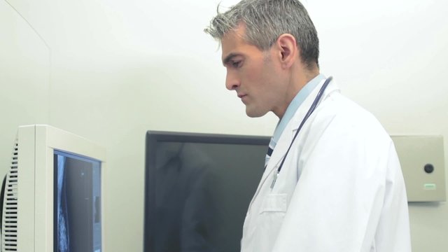 Doctor looking at computer