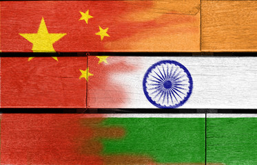 Fototapeta na wymiar china and india flag on wood