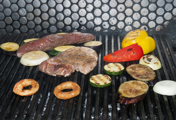cooking beef steak on a grill in the restaurant