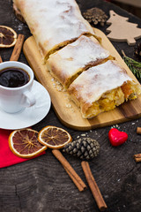 Strudel with custard and orange. Christmas Stollen. Christmas table decoration.