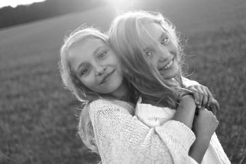 portrait of two sisters during the autumn harvest