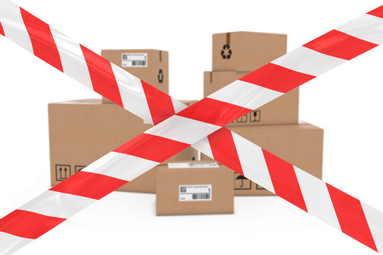 Dangerous Parcels Concept - Stack Of Cardboard Boxes Behind Red And White Barrier Tape Cross