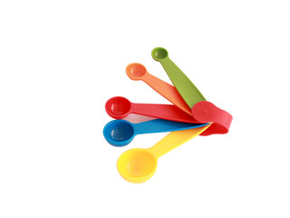 Colorful measuring spoons isolated on white