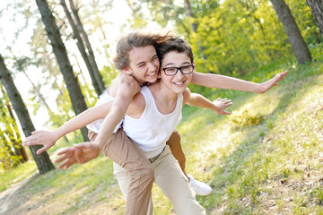 Obraz premium Portrait of a boy and girl in summer